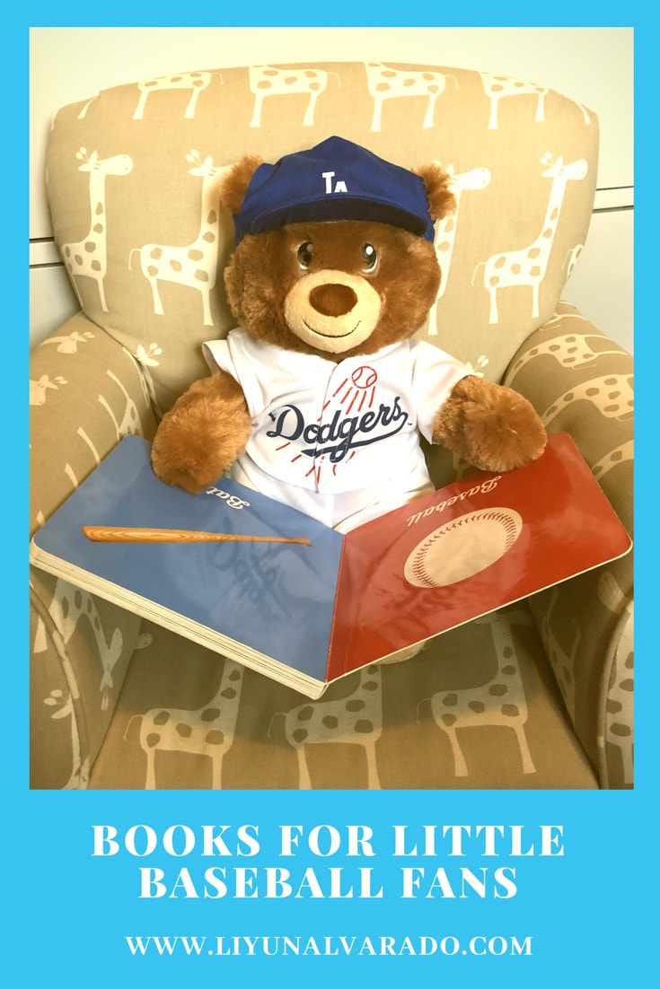 Teddy Bear in a Dodgers uniform reads a baseball board book.